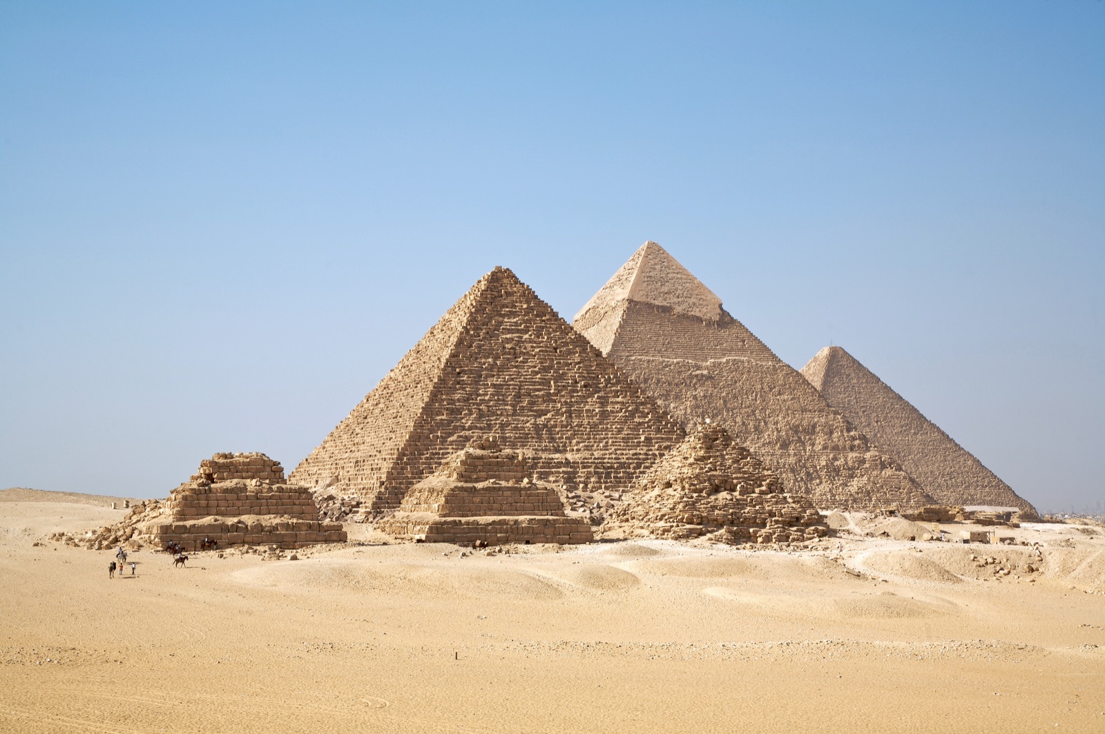 The pyramids of Giza set against the open desert